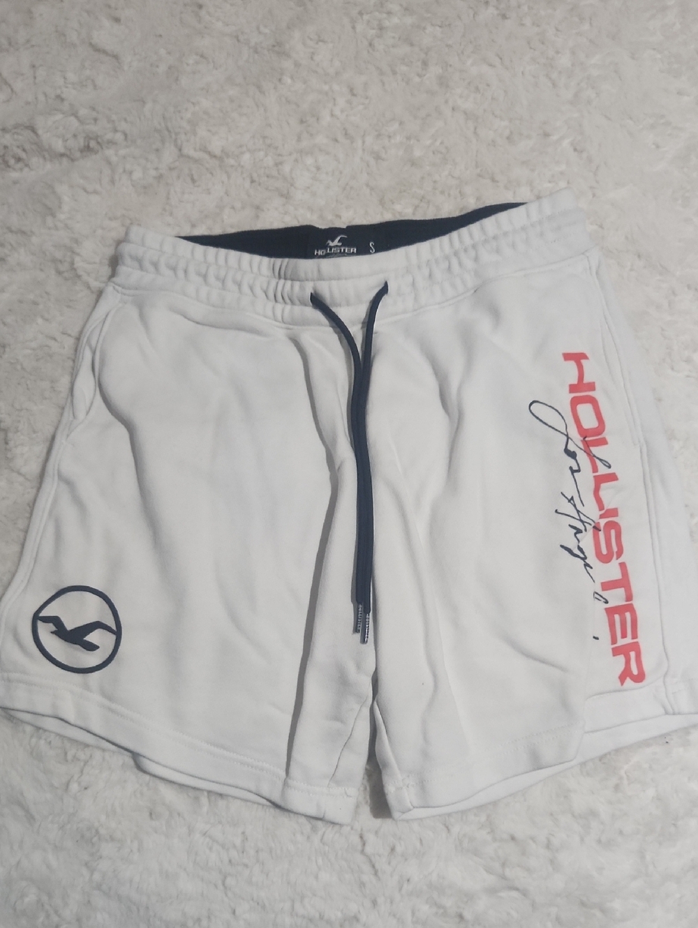 Hollister White Athletic Shorts with Navy Drawstring and Red Side Logo